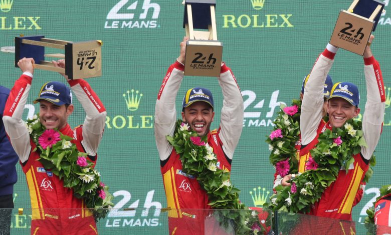 Ferrari 499P Hybrid Hypercar WEC's drivers Miguel Molina (L) of Spain, Antonio Fuoco of Italy and Nicklas Nielsen of Denmark celebrate on the podium after winning the 92nd edition of the Le Mans 24-hours endurance race in Le Mans, western France, on June 16, 2024. Ferrari won a wild and wet 92nd edition of the Le Mans 24 Hours race on June 16, 2024, as Nicklas Nielsen took the chequered flag after a vintage and gruelling race, the Dane sharing driving duties in the Italian constructor's No 50 car with Italian Antonio Fuoco and Spaniard Miguel Molina. (Photo by FRED TANNEAU / AFP) (Photo by FRED TANNEAU/AFP via Getty Images)