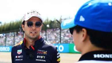 SUZUKA, JAPAN - APRIL 07: Sergio Perez of Mexico and Oracle Red Bull Racing talks with Yuki Tsunoda of Japan and Visa Cash App RB on the drivers parade prior to the F1 Grand Prix of Japan at Suzuka International Racing Course on April 07, 2024 in Suzuka, Japan. (Photo by Mark Thompson/Getty Images)