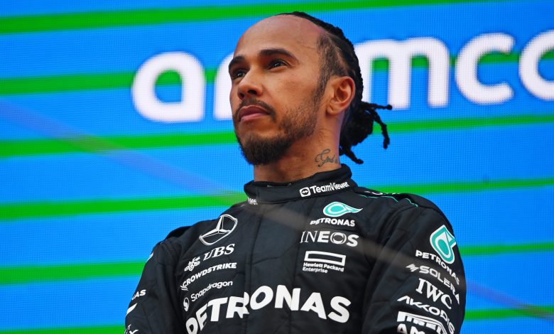 BARCELONA, SPAIN - JUNE 23: Third placed Lewis Hamilton of Great Britain and Mercedes stands on the podium after the F1 Grand Prix of Spain at Circuit de Barcelona-Catalunya on June 23, 2024 in Barcelona, Spain. (Photo by Rudy Carezzevoli/Getty Images)