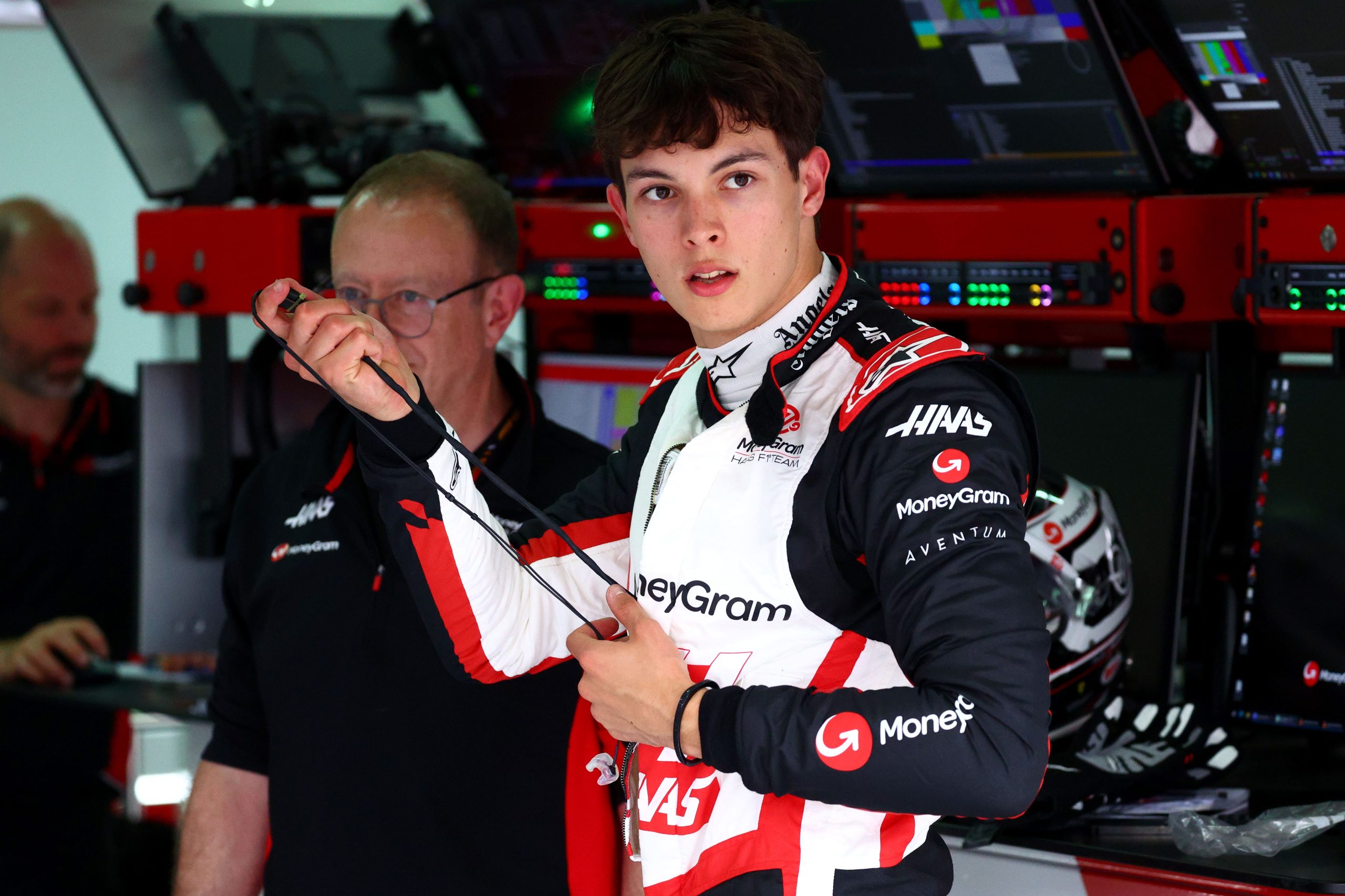 IMOLA, ITALY - MAY 16: Oliver Bearman of Great Britain and Haas F1 prepares for a seat fitting in the garage during previews ahead of the F1 Grand Prix of Emilia-Romagna at Autodromo Enzo e Dino Ferrari Circuit on May 16, 2024 in Imola, Italy. (Photo by Clive Rose/Getty Images)
