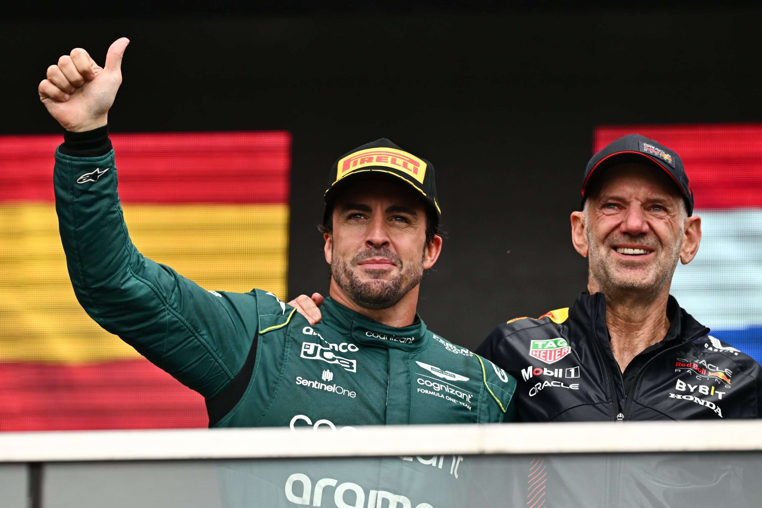 MONTREAL, QUEBEC - JUNE 18: Second placed Fernando Alonso of Spain and Aston Martin F1 Team and Adrian Newey, the Chief Technical Officer of Red Bull Racing celebrate on the podium during the F1 Grand Prix of Canada at Circuit Gilles Villeneuve on June 18, 2023 in Montreal, Quebec. (Photo by Minas Panagiotakis/Getty Images)