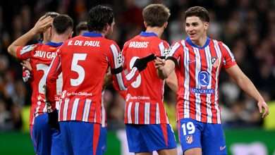 MADRID, SPAIN - MARCH 04: Julian Alvarez of Atletico de Madrid celebrates scoring his team's first goal with teammate Rodrigo De Paul during the UEFA Champions League 2024/25 Round of 16 first leg match between Real Madrid C.F. and Atletico de Madrid at Santiago Bernabeu Stadium on March 04, 2025 in Madrid, Spain. (Photo by Denis Doyle/Getty Images)