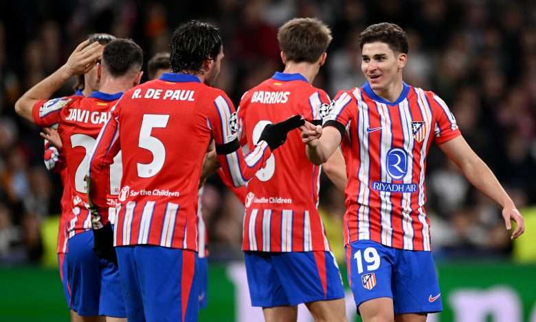 MADRID, SPAIN - MARCH 04: Julian Alvarez of Atletico de Madrid celebrates scoring his team's first goal with teammate Rodrigo De Paul during the UEFA Champions League 2024/25 Round of 16 first leg match between Real Madrid C.F. and Atletico de Madrid at Santiago Bernabeu Stadium on March 04, 2025 in Madrid, Spain. (Photo by Denis Doyle/Getty Images)