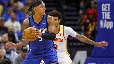 ORLANDO, FLORIDA - APRIL 15: Paolo Banchero #5 of the Orlando Magic posts up Zaccharie Risacher #10 of the Atlanta Hawks during the first half of an NBA play-in tournament game at Kia Center on April 15, 2025 in Orlando, Florida. NOTE TO USER: User expressly acknowledges and agrees that, by downloading and or using this photograph, User is consenting to the terms and conditions of the Getty Images License Agreement. (Photo by Mike Ehrmann/Getty Images)