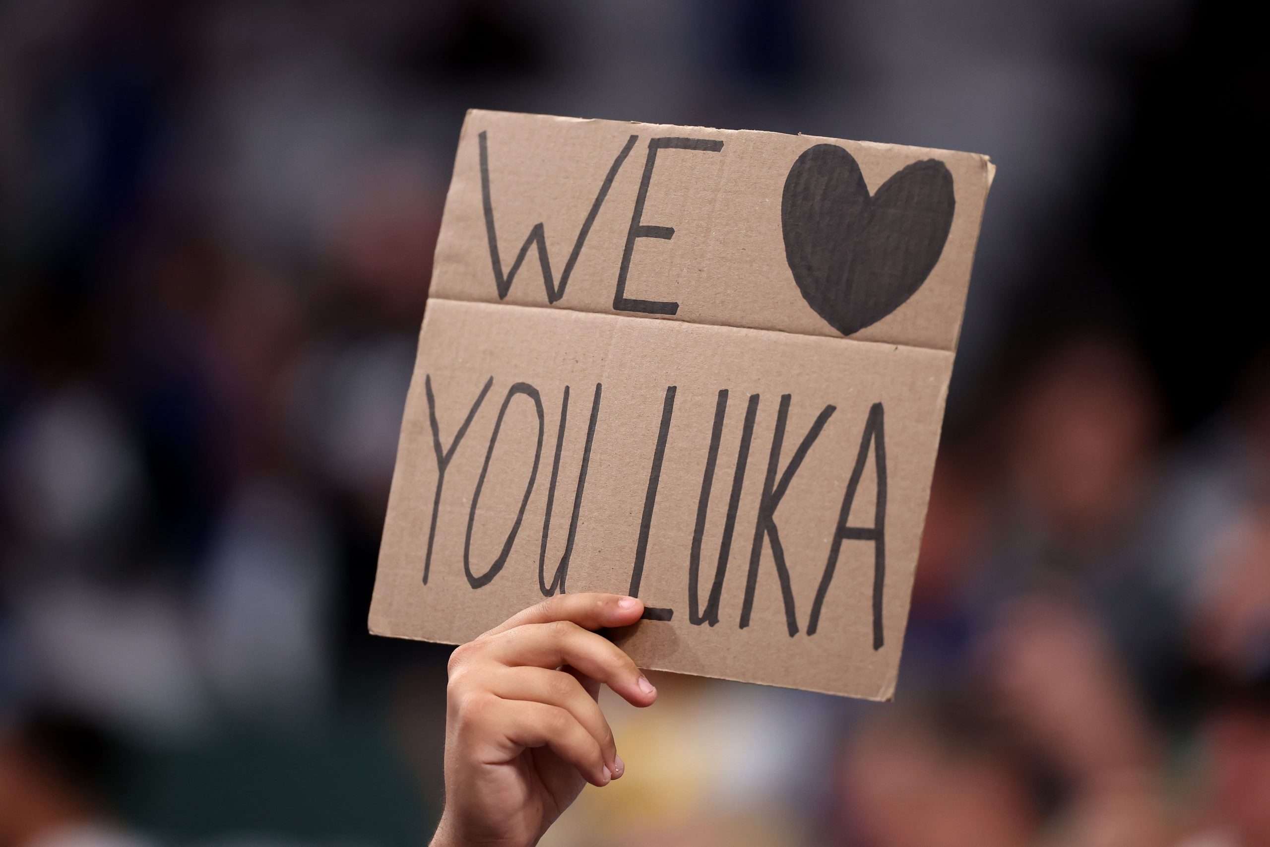 DALLAS, TEXAS - APRIL 09: A fan holds a sign in honor of Luka Doncic #77 of the Los Angeles Lakers before the game against the Dallas Mavericks at American Airlines Center on April 09, 2025 in Dallas, Texas. NOTE TO USER: User expressly acknowledges and agrees that, by downloading and or using this photograph, user is consenting to the terms and conditions of the Getty Images License Agreement. (Photo by Sam Hodde/Getty Images)