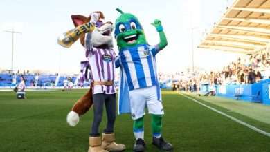 LEGANES, SPAIN - FEBRUARY 03: Super Pepino, mascot of CD Leganes, and Pepe Zorrillo, mascot of Real Valladolid, wave the fans prior to the LaLiga Hypermotion match between CD Leganes and Real Valladolid CF at Estadio Municipal de Butarque on February 03, 2024 in Leganes, Spain. (Photo by Angel Martinez/Getty Images)