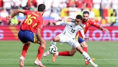 Jamal Musiala of Germany controls the ball under pressure from Daniel Carvajal and Rodri of Spain during the UEFA EURO 2024 quarter-final match between Spain and Germany at Stuttgart Arena on July 05, 2024 in Stuttgart, Germany. (Photo by Alexander Hassenstein/Getty Images)
