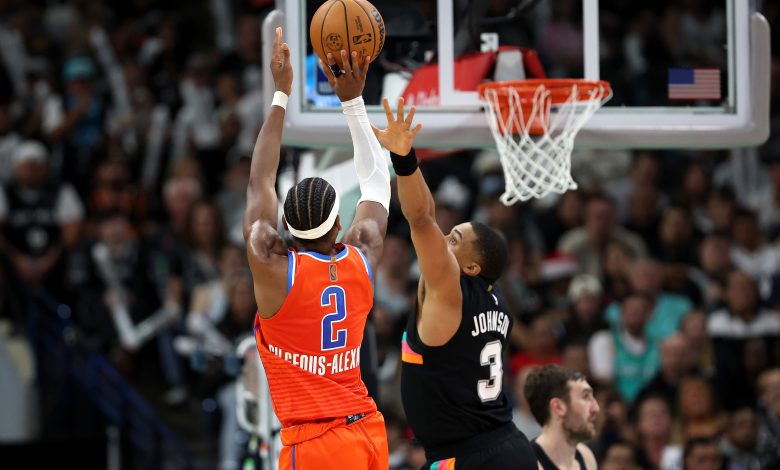 SAN ANTONIO, TEXAS - DECEMBER 23: Shai Gilgeous-Alexander #2 of the Oklahoma City Thunder shoots the ball during the game against Keldon Johnson #3 of the San Antonio Spurs at Frost Bank Center on December 23, 2025 in San Antonio, Texas. (Photo by Kenneth Richmond/Getty Images)