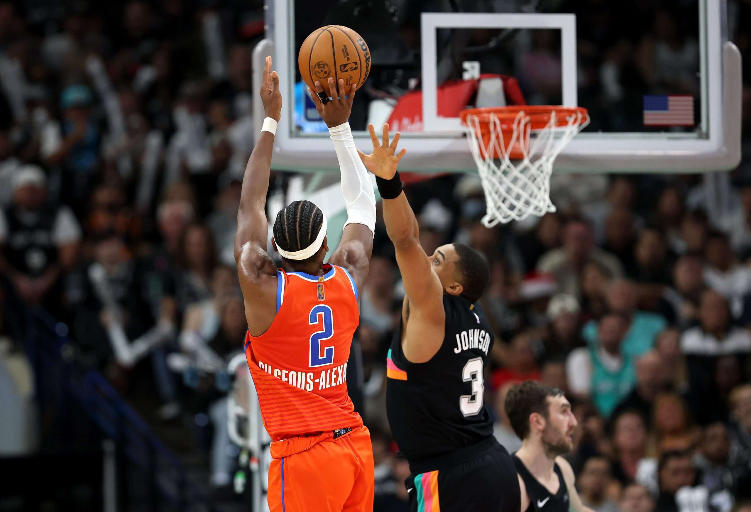 SAN ANTONIO, TEXAS - DECEMBER 23: Shai Gilgeous-Alexander #2 of the Oklahoma City Thunder shoots the ball during the game against Keldon Johnson #3 of the San Antonio Spurs at Frost Bank Center on December 23, 2025 in San Antonio, Texas. (Photo by Kenneth Richmond/Getty Images)