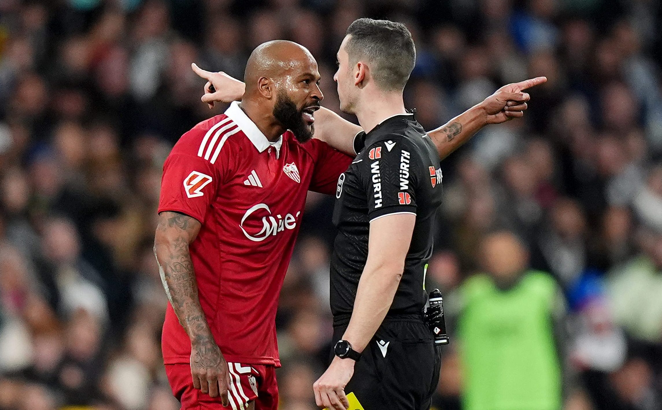 Marcao of Sevilla FC reacts after he is sent off by Referee, Alejandro Muniz, after receiving a second yellow card, during the LaLiga EA Sports match between Real Madrid CF and Sevilla FC at Estadio Santiago Bernabeu on December 20, 2025 in Madrid, Spain. (Photo by Angel Martinez/Getty Images)
