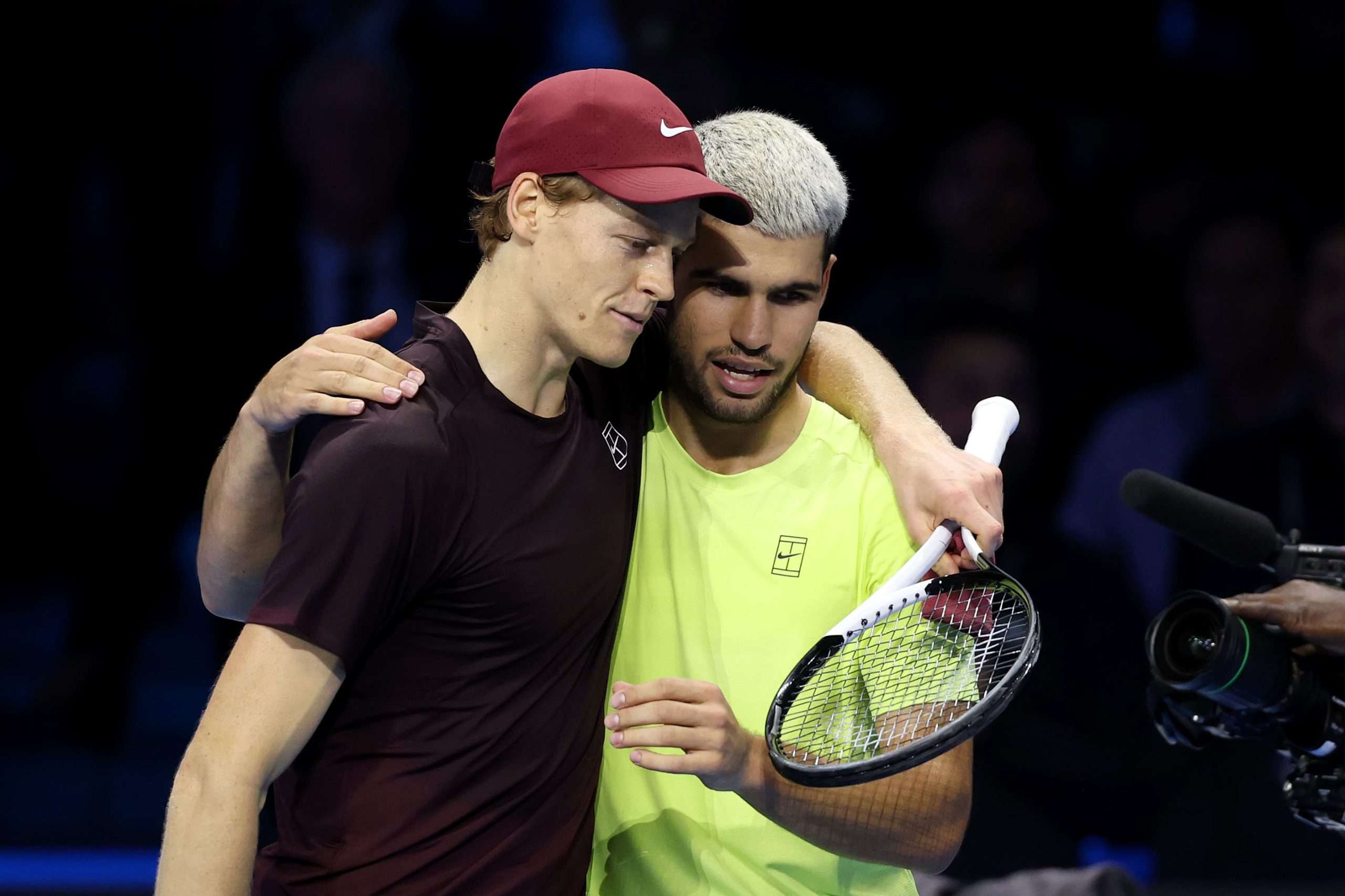Jannik Sinner of Italy hugs Carlos Alcaraz of Spain following the Men's Singles Final on day eight of the Nitto ATP Finals 2025 at Inalpi Arena on November 16, 2025 in Turin, Italy. (Photo by Clive Brunskill/Getty Images)