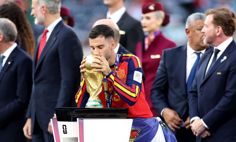 Alex Baena #15 of Spain kisses the FIFA World Cup Winner's Trophy as he receives the medal following the FIFA World Cup 2026 Final match between Spain and Argentina at New York New Jersey Stadium on July 19, 2026 in East Rutherford, New Jersey. (Photo by Dan Mullan/Getty Images)